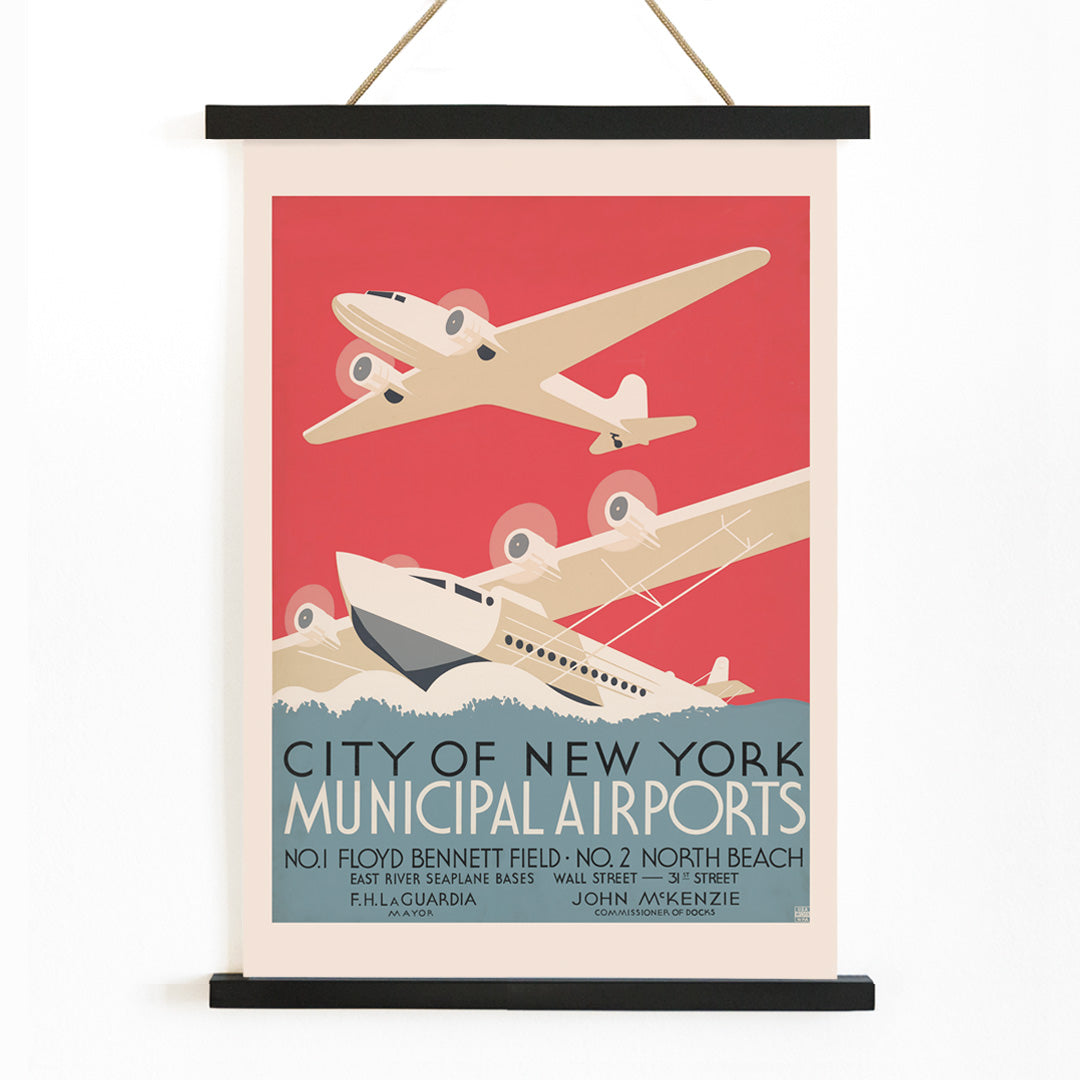 Vintage poster of stylized airplanes flying over water for City of New York municipal airports featuring bold artwork title and locations Floyd Bennett Field and North Beach, with wooden magnetic frame on white background