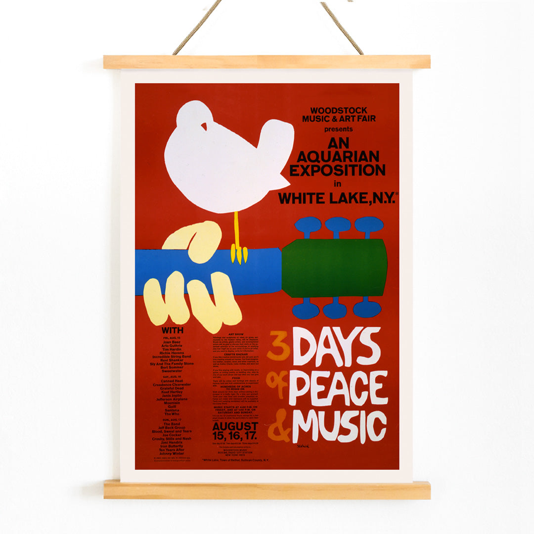 Woodstock poster with white dove on guitar promoting peace and music at An Aquarian Exposition in White Lake artist unknown, with wooden magnetic frame on white background