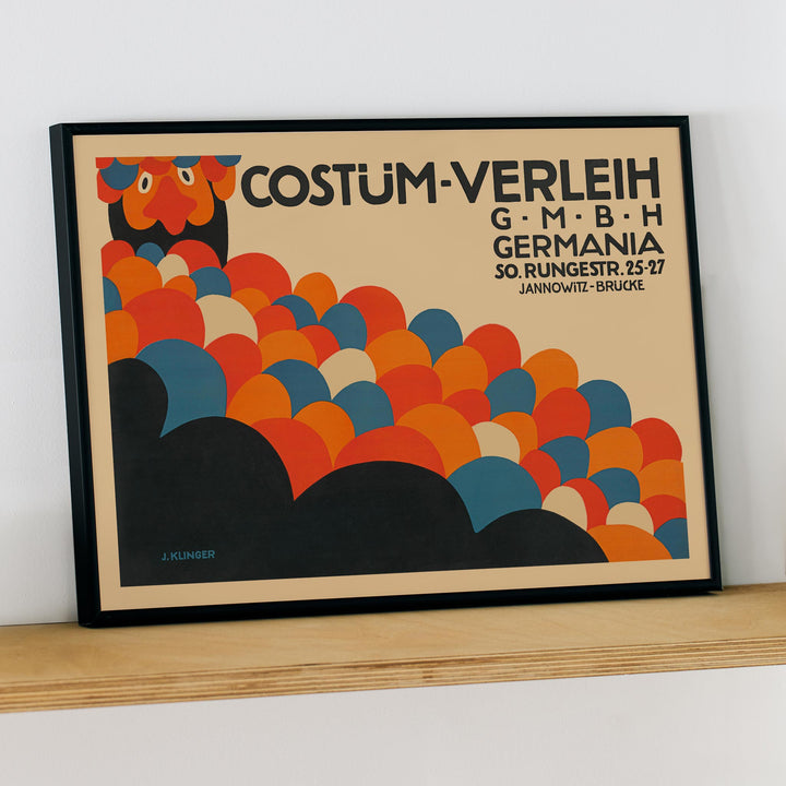 Poster by Julius Klinger for Costüm-Verleih Germania with red blue orange and black abstract circles and bold typography, framed and displayed in modern living room decor
