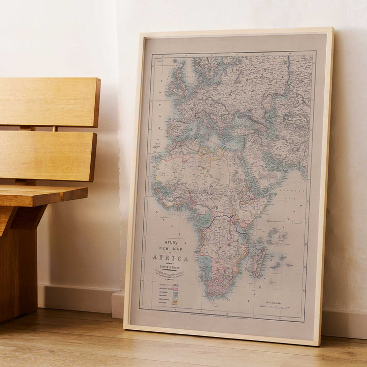 Wyld New Map of Africa vintage cartographic poster in beige grey blue and red tones, framed and displayed in modern living room decor
