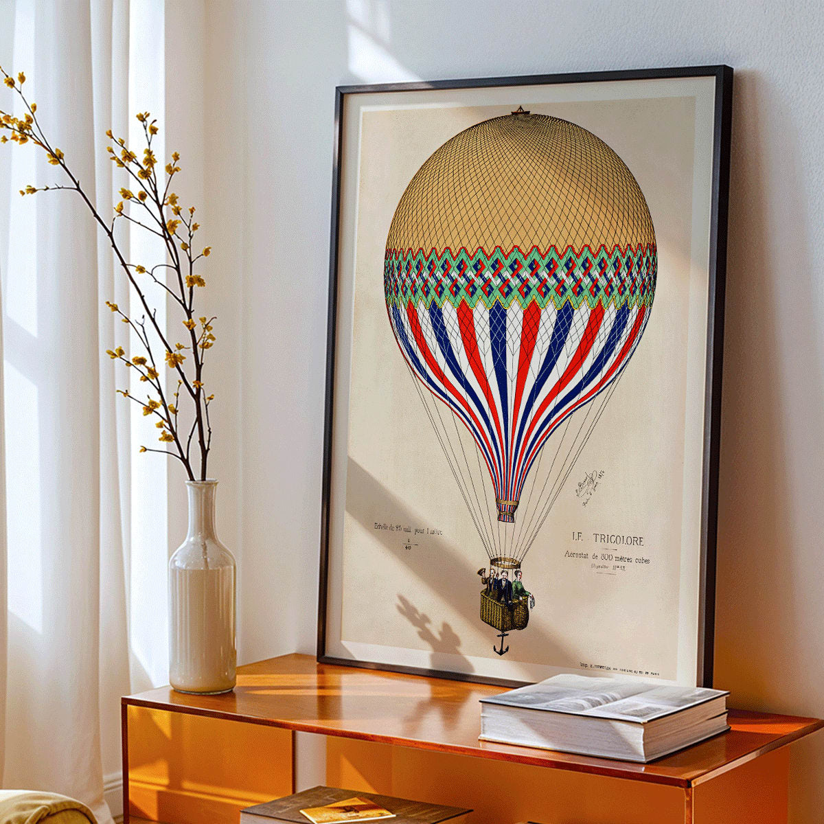 French flag hot air balloon in red white and blue ascending over Paris artwork Le Tricolore by E Hennequin with passengers, framed and displayed in modern living room decor