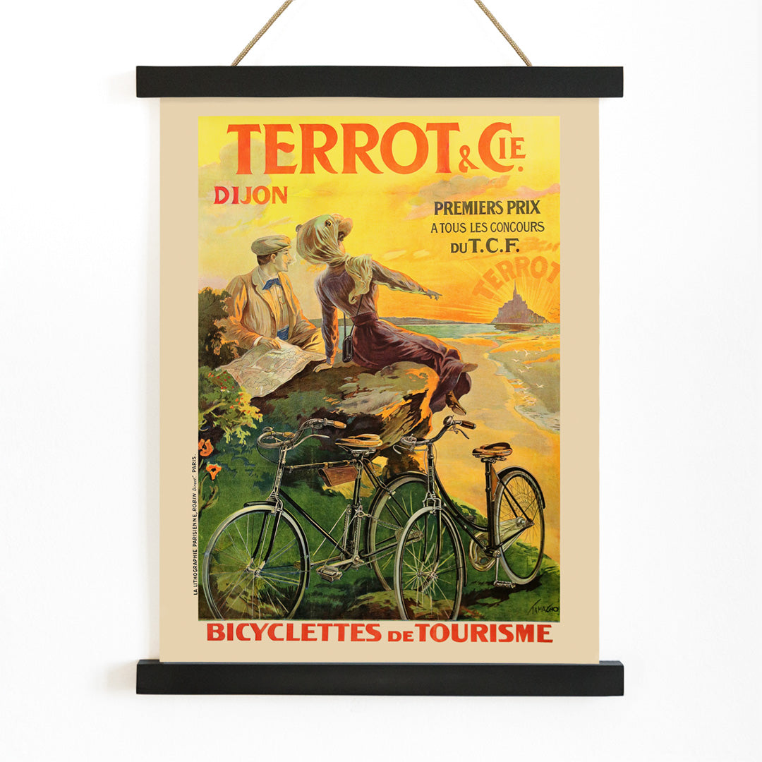 Vintage poster Terrot And Cie Dijon Bicyclettes De Tourisme by Armand Masson showing a couple with touring bicycles overlooking the coast at sunset, with wooden magnetic frame on white background