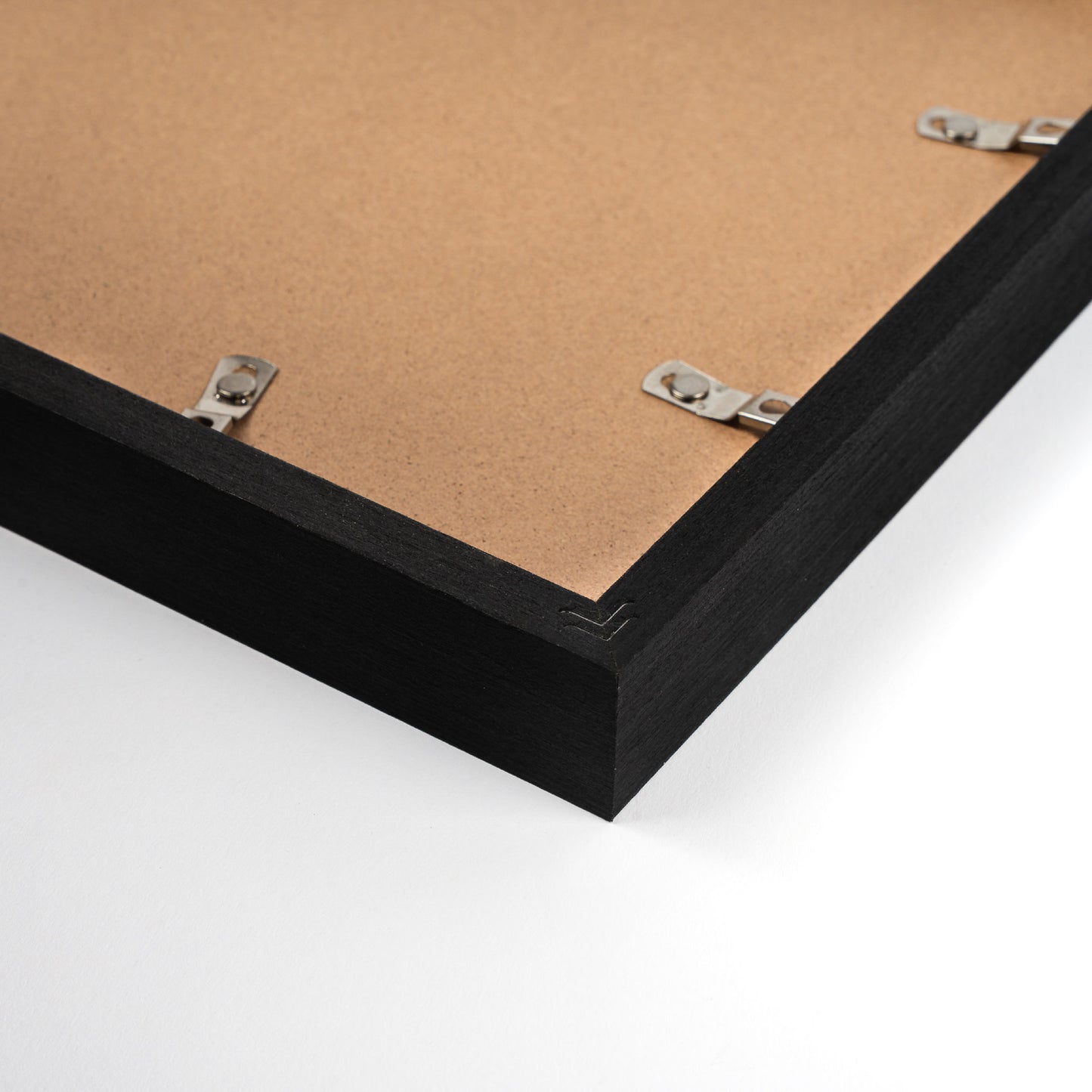 Black pine wood photo frame with elegant black finish, showcasing a classic and refined design suitable for displaying photos or artwork in home or office settings, back corner closeup picture