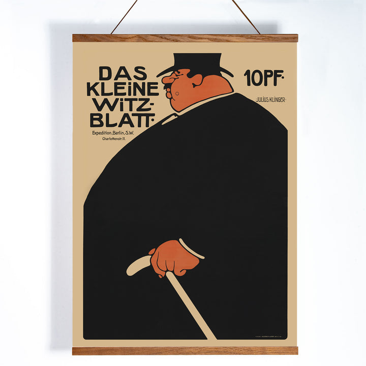 Julius Klinger Das kleine Witzblatt poster with bold black silhouette orange face and hand on beige minimalist background, with wooden magnetic frame on white background