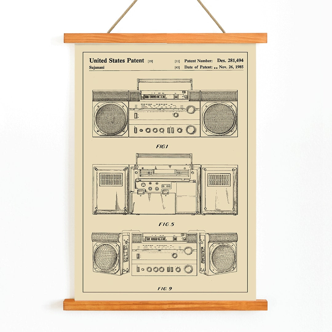 Portable combined cassette player technical drawing and poster illustrations by Sujanani United States Patent detailed technical drawings, with wooden magnetic frame on white background