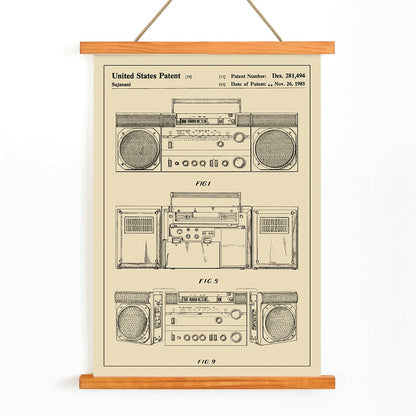 Portable combined cassette player technical drawing and poster illustrations by Sujanani United States Patent detailed technical drawings, with wooden magnetic frame on white background