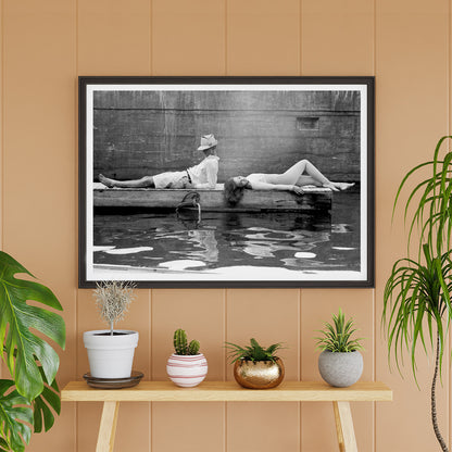 Marquess of Tavistock Henry Robin Ian Russell and Henrietta Tiarks relaxing on a dock in Bermuda by Toni Frissell poster, framed and displayed in home decor
