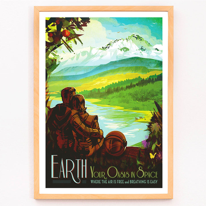 Two people in spacesuits admire a lush green landscape with mountains and a lake Earth Your Oasis in Space by NASA poster artwork, framed and displayed in modern living room decor