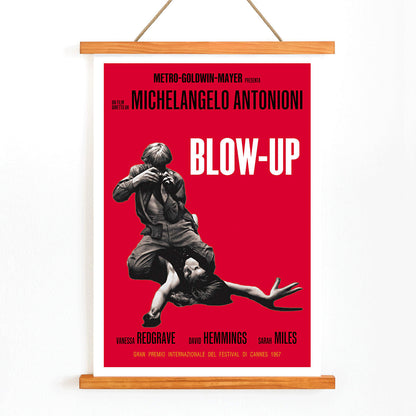 Michelangelo Antonioni Blow Up Movie poster with dramatic black and white photography and vibrant red background, with wooden magnetic frame on white background