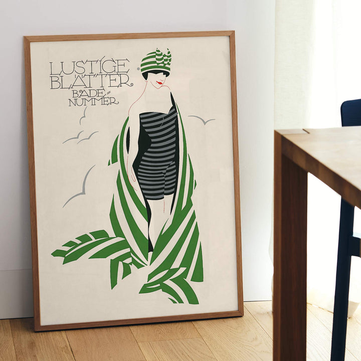 Julius Klinger Lustige Blatter Badenummer poster with stylized woman in striped swimsuit, green palm leaves, cream background, framed and displayed in modern living room decor