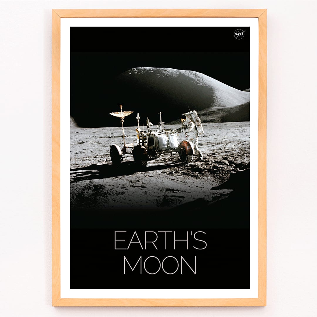 Astronaut beside lunar rover on the moon surface Man on Moon 1 by NASA poster with Earths Moon text, framed and displayed in modern living room decor