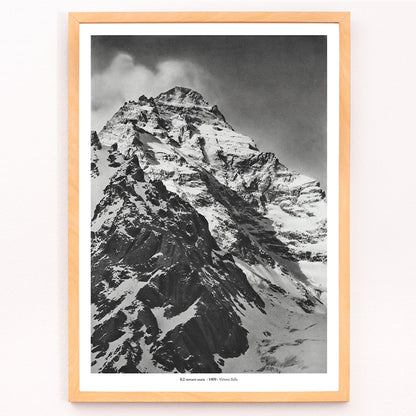 Black and white photograph and poster of K2 west face by Vittorio Sella showing the snow-covered mountain peak, framed and displayed in modern living room decor