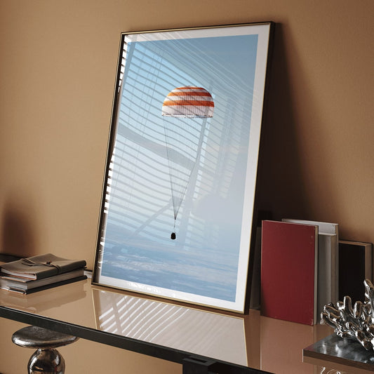 Soyuz MS-02 spacecraft descending with parachute over Kazakhstan NASA poster titled The Soyuz MS-02 spacecraft lands, framed and displayed in home decor