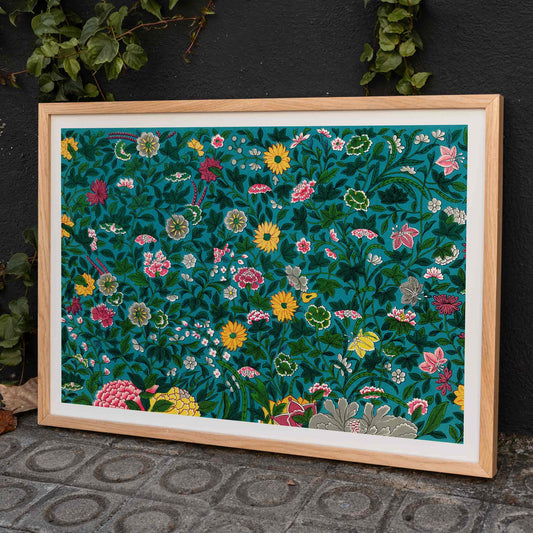 Vibrant floral poster with green botanical pattern by Owen Jones on teal background, framed and displayed in home decor