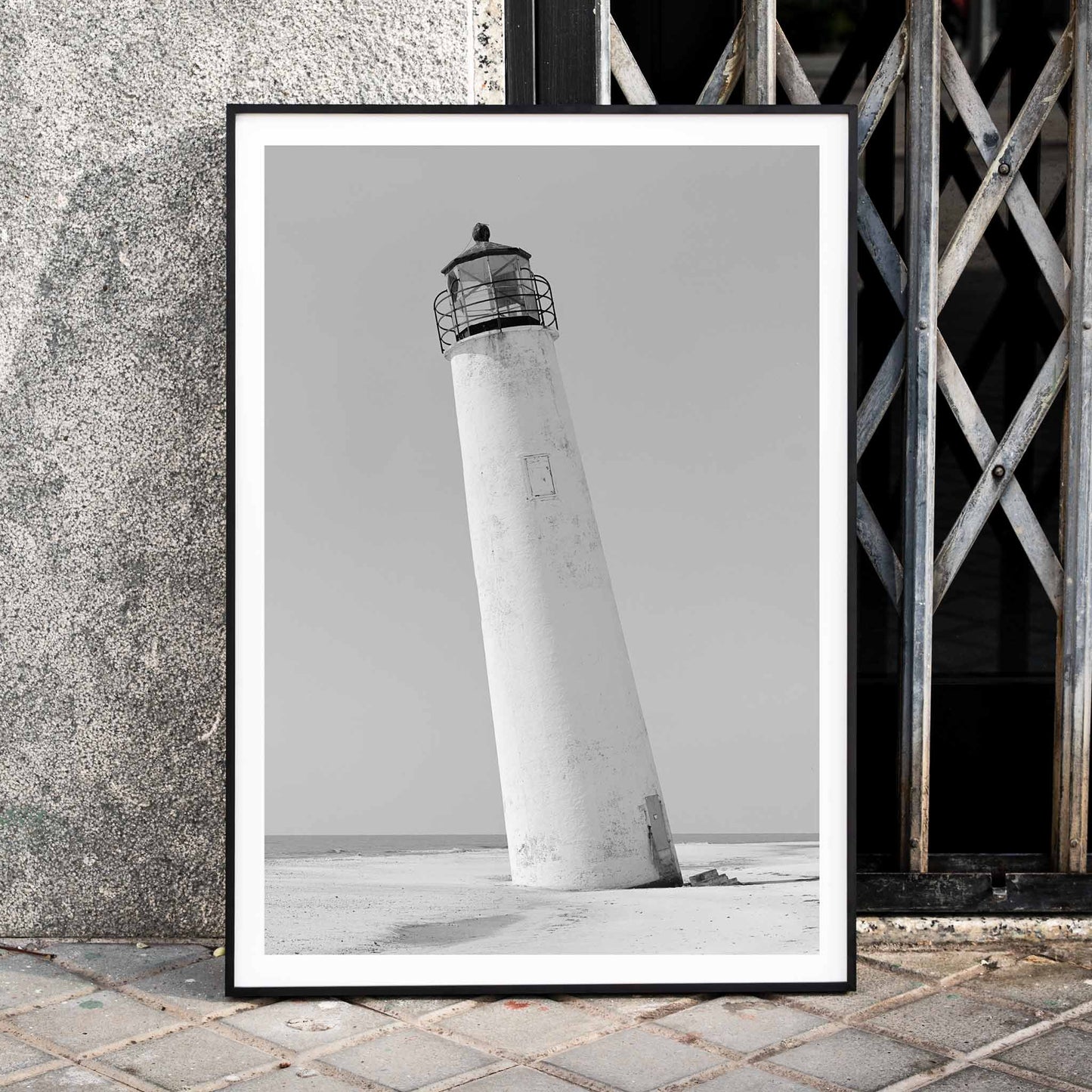Cape Saint George Lighthouse poster featuring a tilted lighthouse on a sandy beach in Apalachicola Franklin County Florida, framed and displayed in home decor