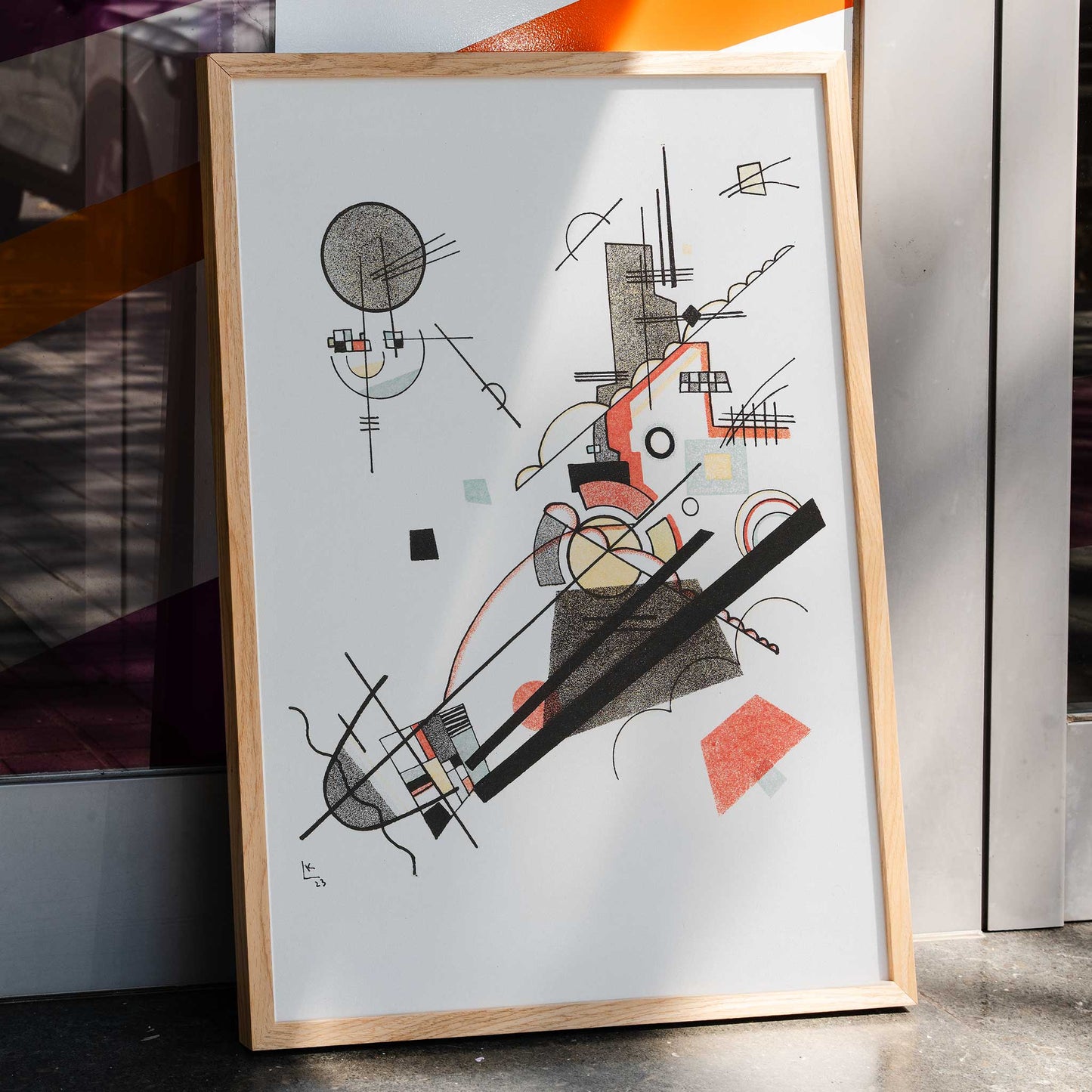 Abstract geometric art poster with intersecting lines and shapes in black red and yellow Fröhlicher Aufstieg by Wassily Kandinsky, framed and displayed in home decor