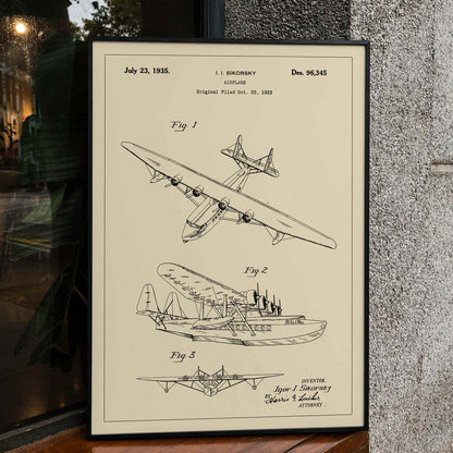 Detailed technical drawing and poster of a seaplane airplane patent by Igor I Sikorsky featuring multiple views and aircraft design sketches, framed and displayed in home decor