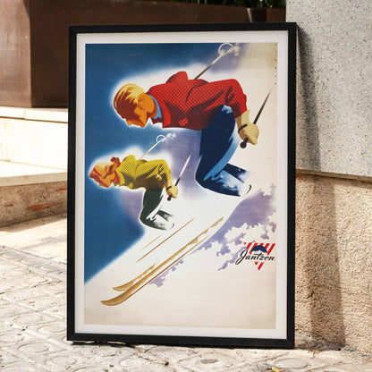 Vintage skiing poster of man and woman skiing downhill in bold colors by Joseph Binder for Jantzen, framed and displayed in home decor