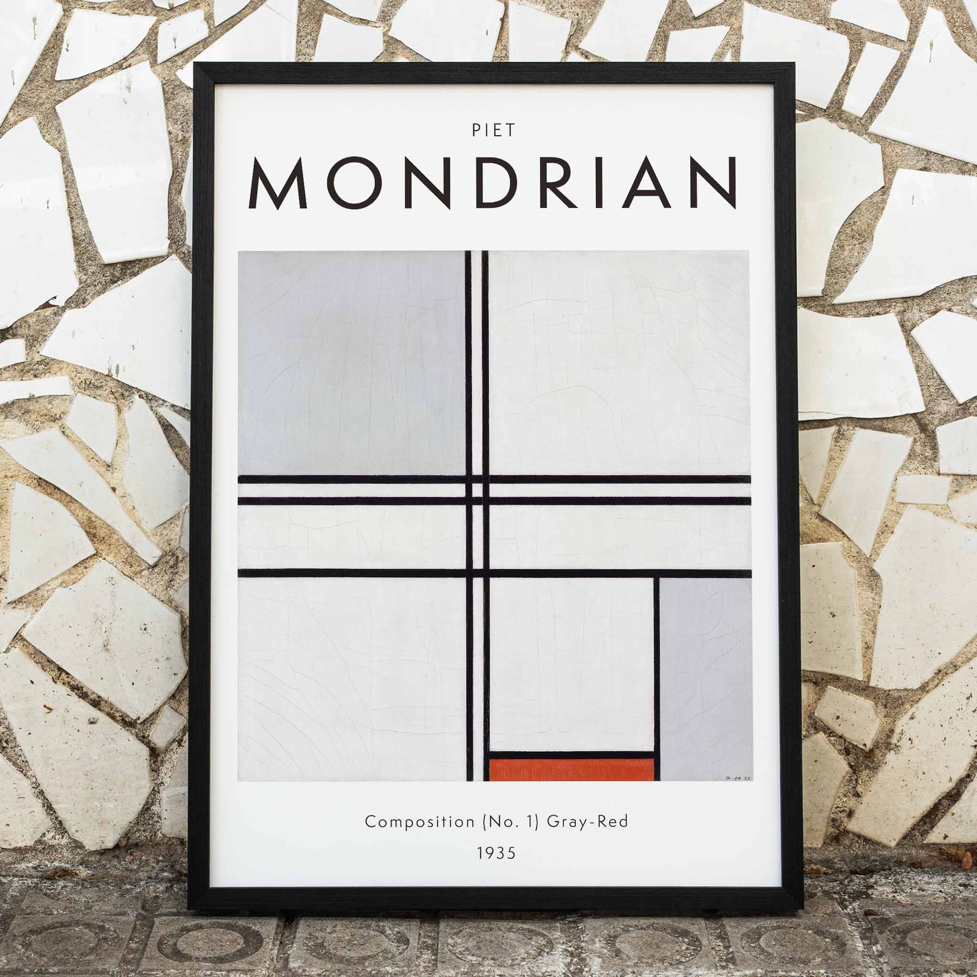 Geometric abstract artwork poster with black lines and color blocks by Piet Mondrian Composition No 1 Gray-Red, framed and displayed in home decor