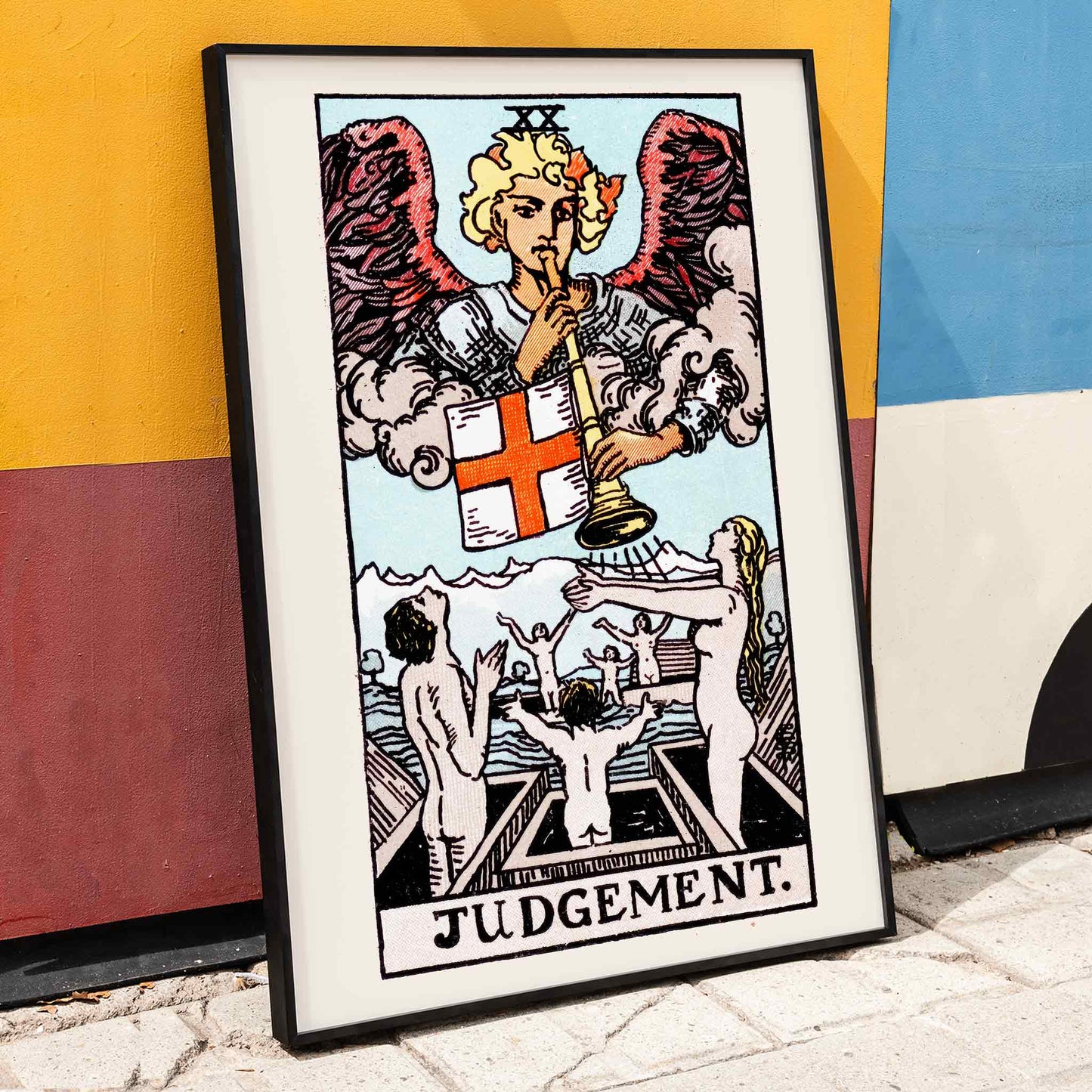 Judgement tarot card by Rider Waite showing an angel with a trumpet and people rising from graves poster, framed and displayed in home decor