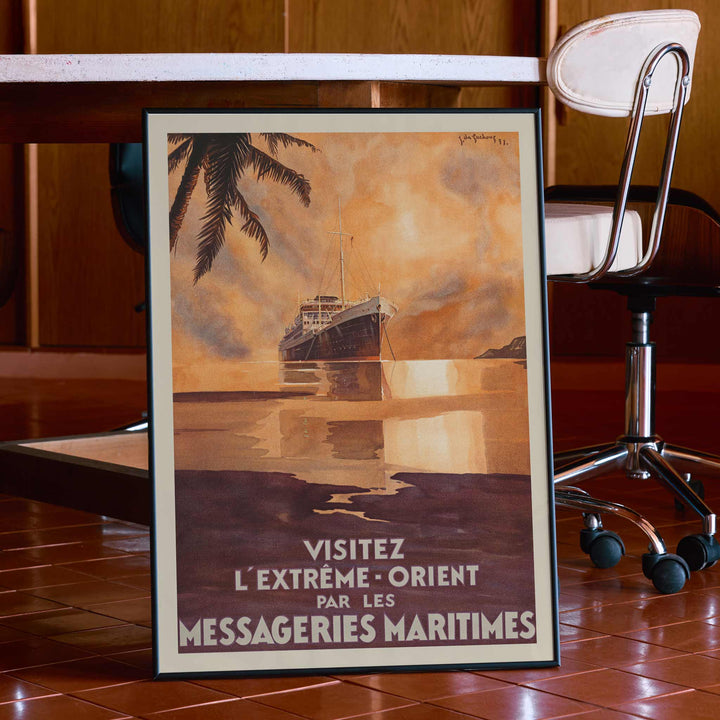 Visit the Far East by Messageries Maritimes poster with ship on calm water at sunset, palm silhouettes, maritime travel style, with wooden magnetic frame on white background
