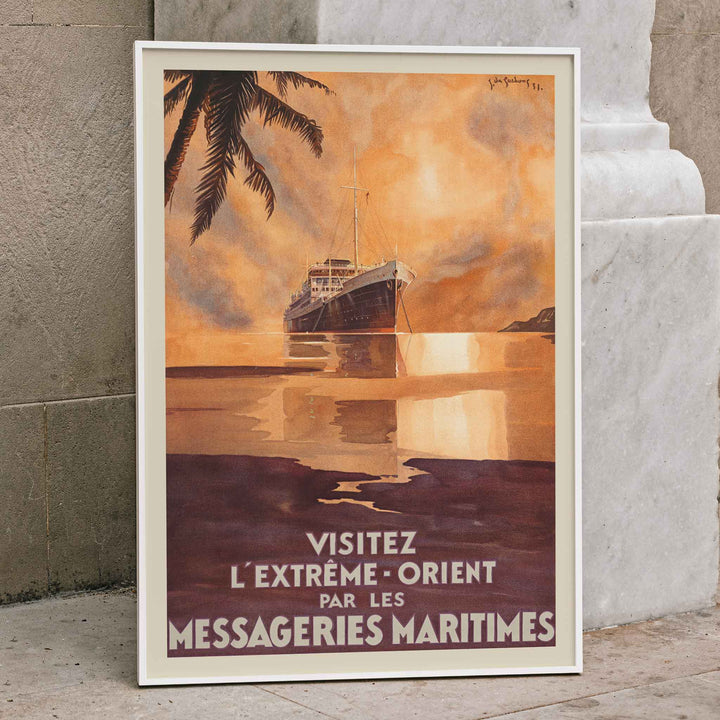 Visit the Far East by Messageries Maritimes poster with ship on calm water at sunset, palm silhouettes, maritime travel style, framed and displayed in home decor