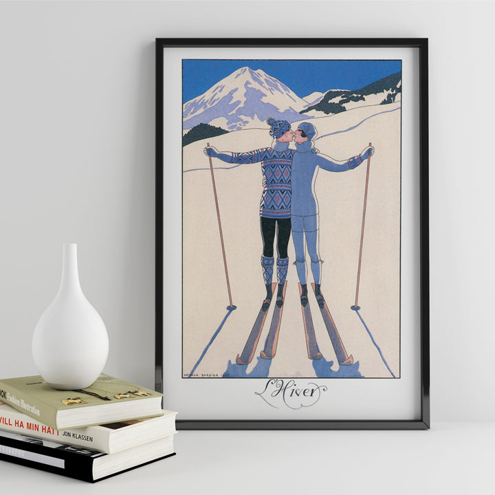 Two skiers kissing in snowy mountain landscape L Hiver by George Barbier vintage poster artwork, framed and displayed in home decor
