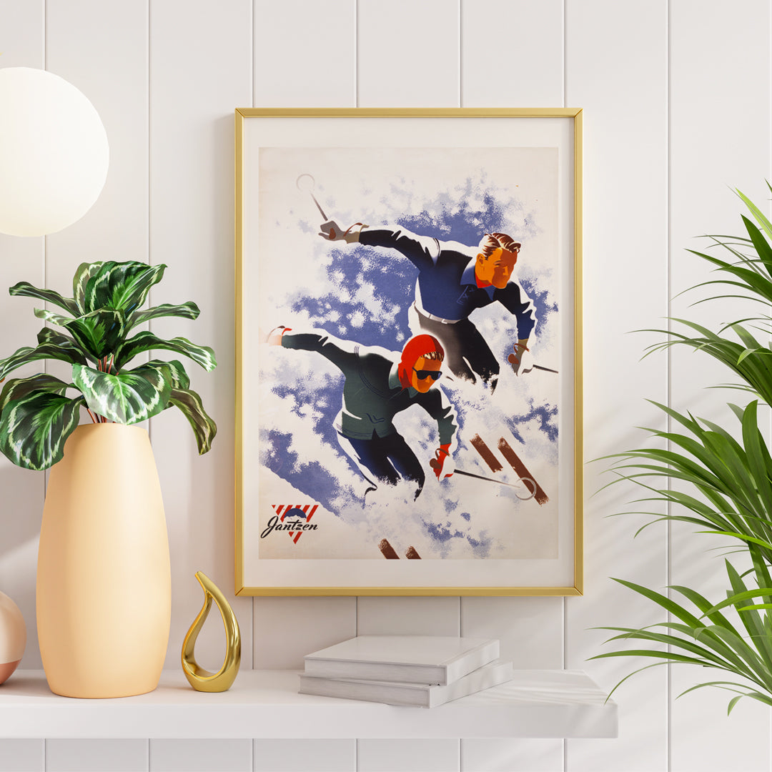 Poster of man and woman skiing down snowy slope artwork by Joseph Binder, framed and displayed in home decor