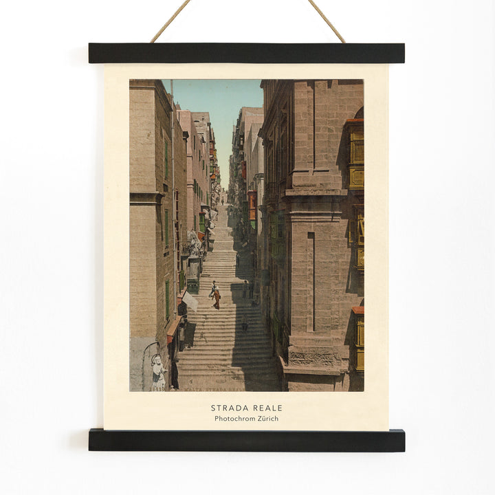 Steep stone staircase and historic street scene with people in Valletta Strada Reale by Photochrom Zurich, with wooden magnetic frame on white background